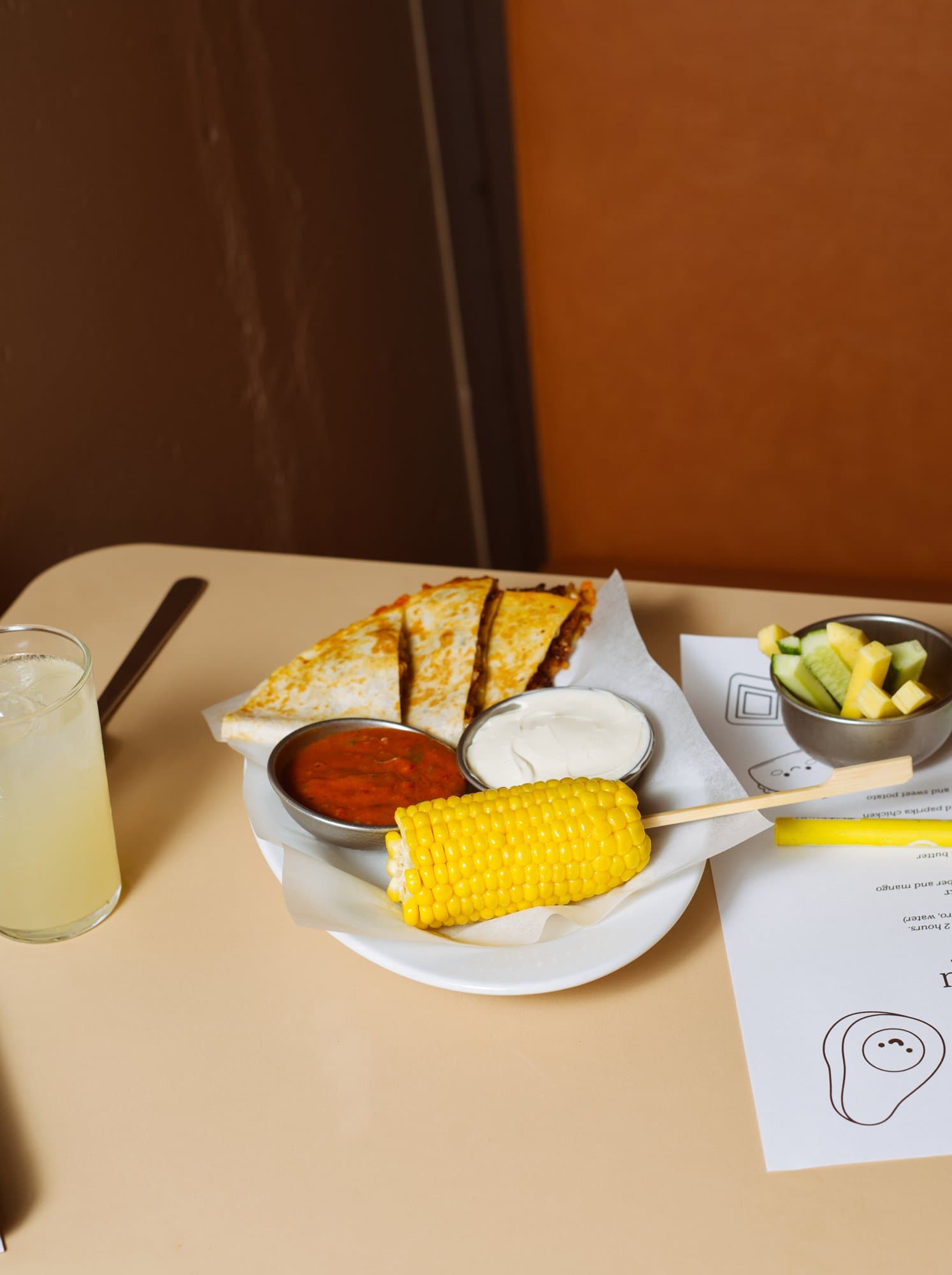 Kids menu at Mæxico: quesadillas, corn on the cob, salsa, lemonade and cucumber and mango sticks